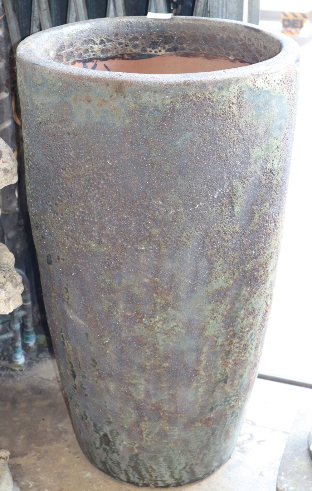 An Atlantis glazed cylindrical planter, W.53cm, H.92cm